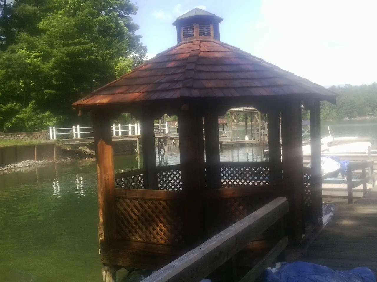 Cedar shake gazebo roof rebuilt on a lake dock in Rock Springs